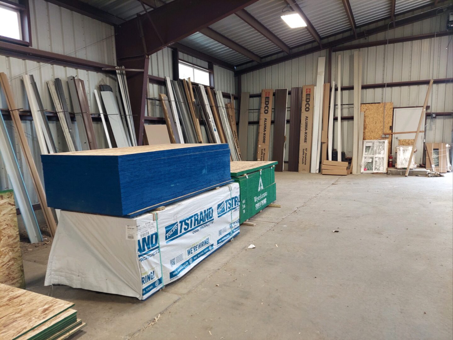 A warehouse filled with lots of wood and cardboard.