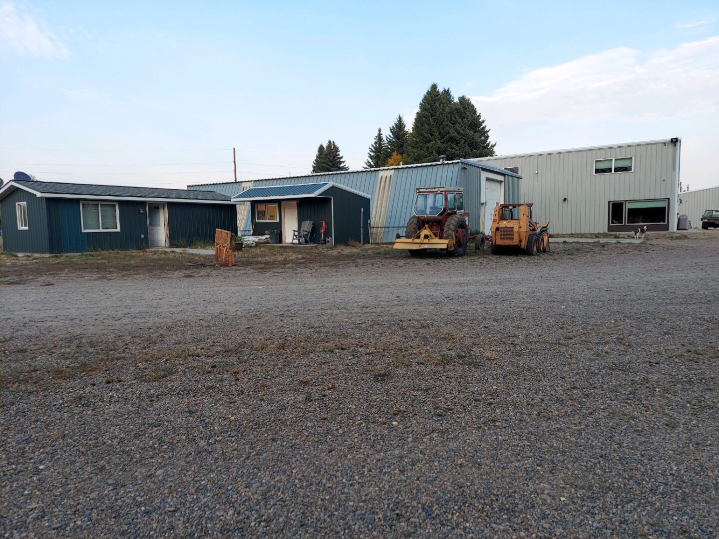 A large parking lot with a building in the background.