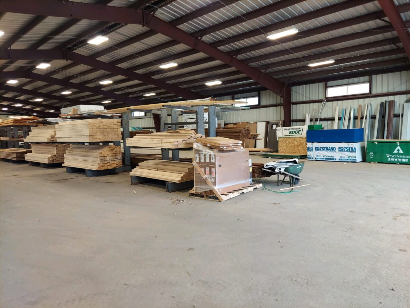 A warehouse filled with lots of wooden boards.